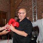 Eddie Beddall receiving his "Heads and Tails" prize from Zinzan Brooke